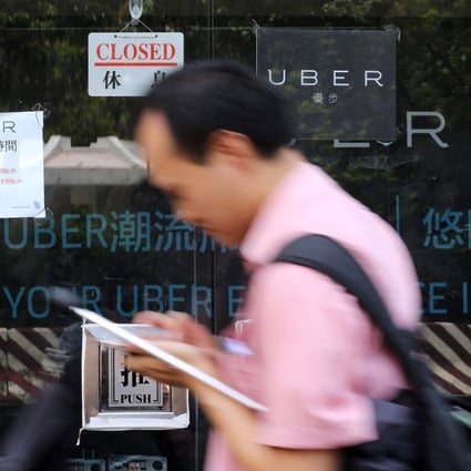 Taxi-and-car-hailing app Uber was raided by Hong Kong police amid claims drivers were unlicensed and lacked proper insurance. Photo: Edward Wong