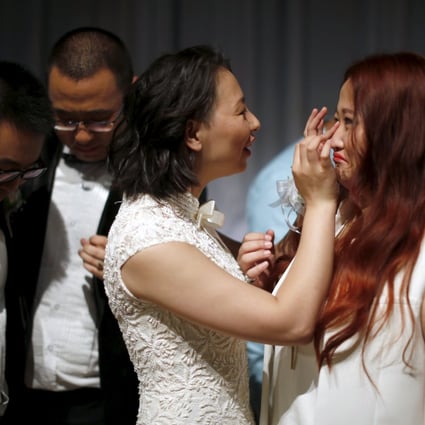 Couples celebrate after a group same-sex wedding for held in California. The gay Chinese couples were selected as winners of a contest hosted by internet giant Alibaba. Photo: Reuters