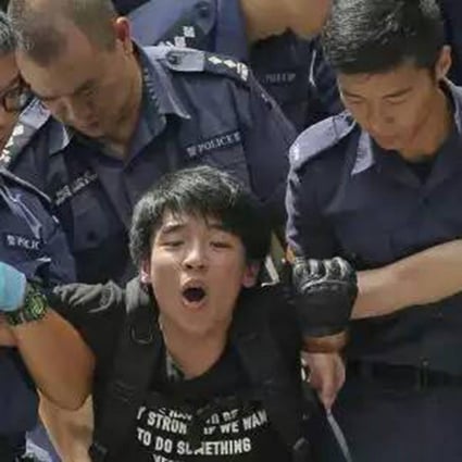 Law Cheuk-yung during his arrest.Photo: SCMP Pictures