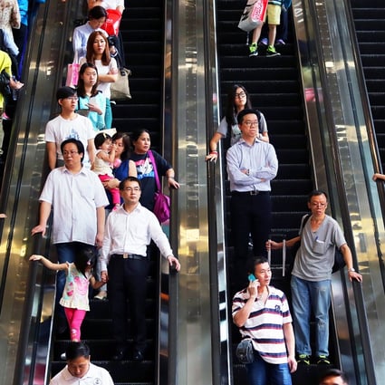 Shoppers are pictured crammed on to escalators in Causeway Bay. Photo: SCMP Pictures 