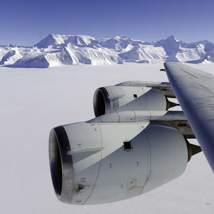 A Nasa flying laboratory surveys Antarctica's ice sheet.  A new study says that burning all the world’s fossil fuel reserves could push up world sea levels by more than 50 metres over thousands of years.  Photo: AFP 