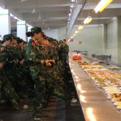 Hungry for knowledge: the students try to concentrate on their drill discipline in full view of their lunch. Photo: Thepaper