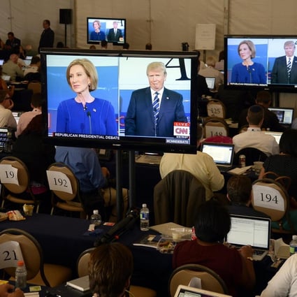 Media watch an exchange between US Republican presidential candidates Donald Trump and Carly Fiorina during the debate. Photo: EPA
