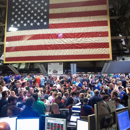 Traders in the Standard & Poor's 500 stock index options pit at the Chicago Board Options Exchange (CBOE) react to the Federal Reserve's decision on interest rates. Photo: AFP