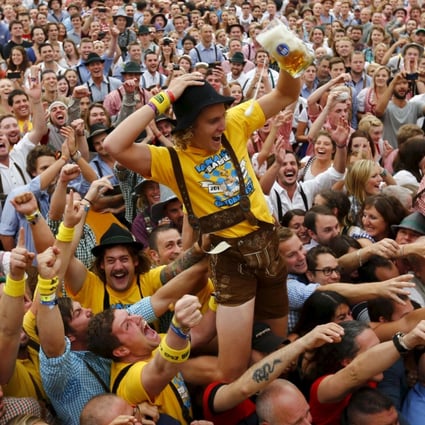 File photo of a visitor celebrating as he drinks one of the first mugs of beer during opening ceremony for a previous Oktoberfest in Munich. Photo: Reuters