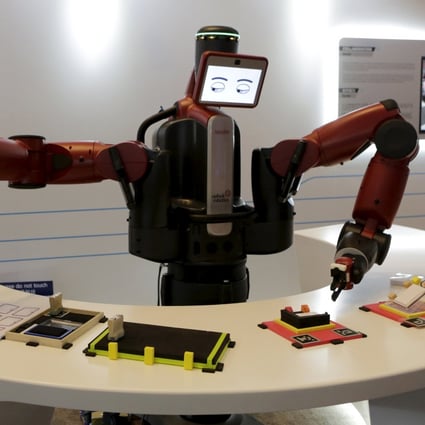 A Baxter robot from US-based Rethink Robotics picks up a business card at the recently held World Economic Forum in China's port city of Dalian in northern Liaoning province. Robotic innovations in Hong Kong are no less impressive. Photo: Reuters