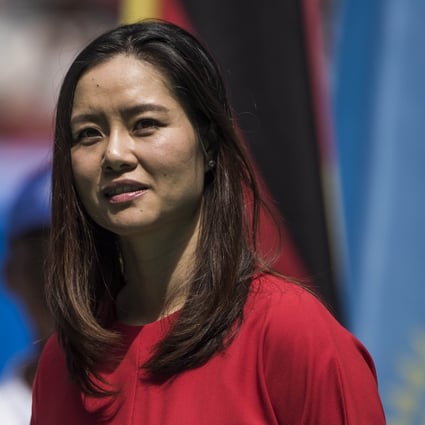 Li Na is back at the Wuhan Open, but instead of playing she is opening the new 15,000-seat stadium. Photo: AFP