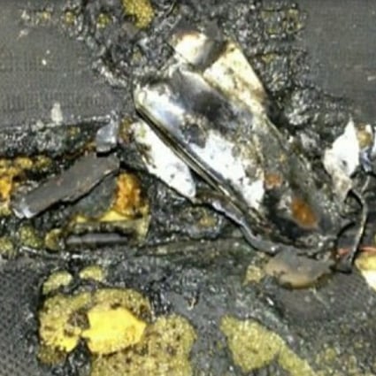 The aftermath of the exploding battery is seen on the burnt car seat upholstery.  Photo: CBS