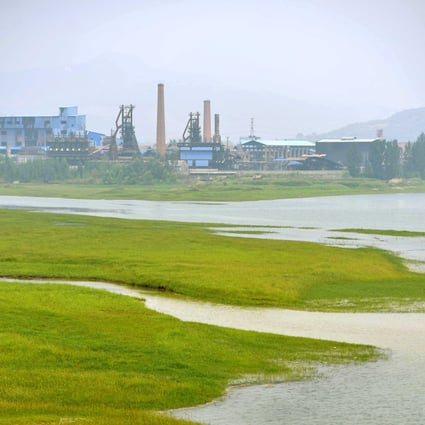 An iron and steel factory is just located in the middle of the Luan River. About 30 per cent of the country's major rivers are polluted or severely polluted. Photo: Xinhua 