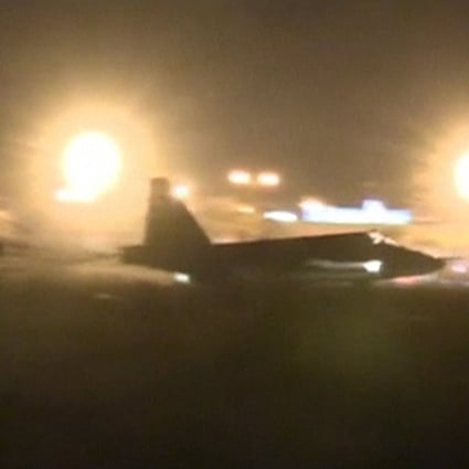 A Russian military jet taxis on a runway shortly after the landing in Syria.  Photo: Reuters