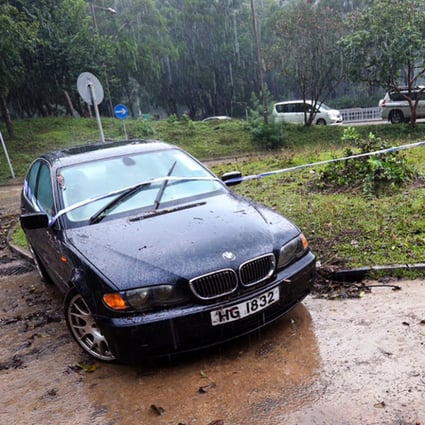 This car was engulfed in rain water at a roundabout near the entrance to Sai Kung Country Park. Photo: Dickson Lee
