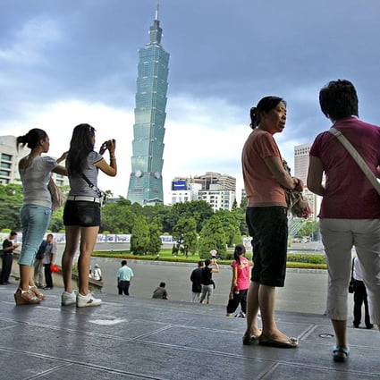Chinese tourists visit the Sun Yat-sen park overlooking Taipei 101. Photo: AP
