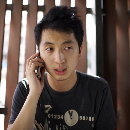Anthony Kwan Hok-chun speaks on the phone after leaving Samut Prakan provincial court in Thailand after he was released on bail on August 24. The crime he has been accused of carries a maximum penalty of five years in gaol. Photo: AP 