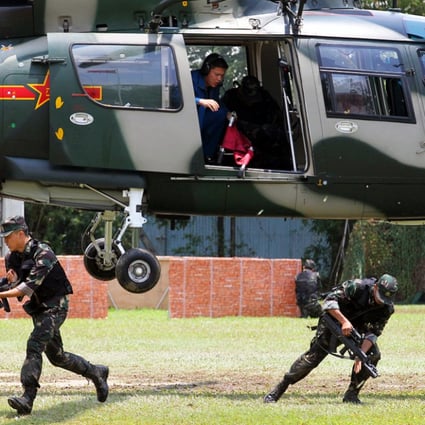 Soldiers of the People's Liberation Army Hong Kong Garrison demonstrate the rescue of an injured comrade by helicopter in an anti-terrorism operation during a PLA garrison open day at Shek Kong. Photo: Nora Tam