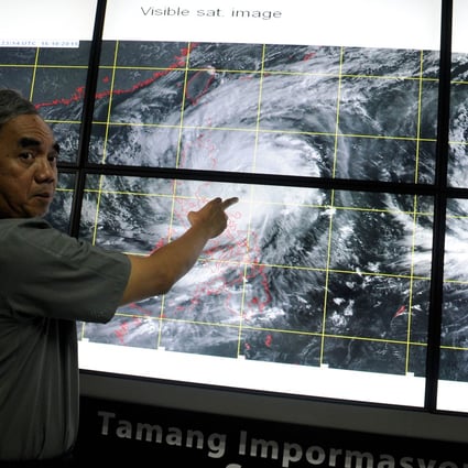 Philippines' undersecretary Alexander Pama, head of the National Disaster Risk Reduction and Management Council (NDRRMC), gives a briefing on Typhoon Koppu, known there as Lando, in suburban Manila on Saturday. Photo: AFP