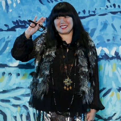 Anna Sui acknowledges the applause after presenting her latest collection in New York in September. Photo: Reuters
