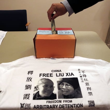 A supporter donates money at an event where Chinese and American writers pushed for the release from house arrest of Liu Xia, the detained wife of Chinese Nobel Peace laureate Liu Xiaobo, in New York. Photo: AP