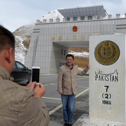 A Chinese national takes a photograph of his colleague at the Khunjerab Pass, the world's highest paved border crossing at 4,600 metres above sea level.Photo: AFP