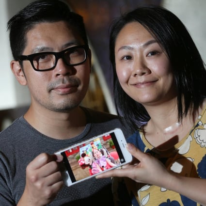 Gary and Hilda Hui with a photo of their three-year-old daughter, Abigail. Photo: K. Y. Cheng