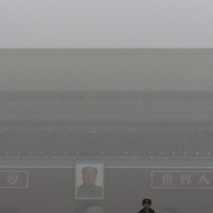 Smog shrouded the Tiananmen Gate in Beijing even as China touted its "green progress". Photo: AP