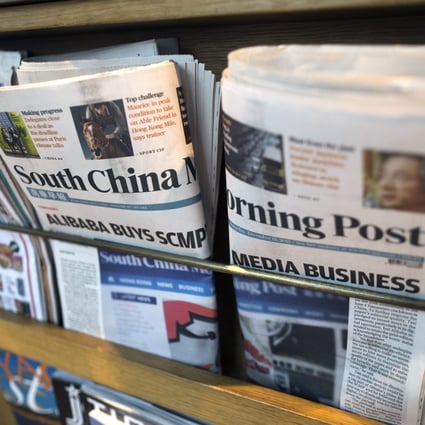 Copies of the South China Morning post on a news rack in Hong Kong. Photo: EPA