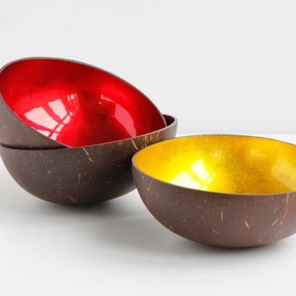 Handcrafted coconut shell bowls from TREE are inlaid with firey colours of red or gold leaf.