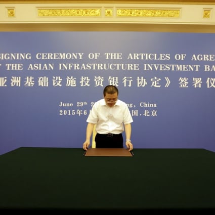 An officer from Chinese Finance Ministry prepares for a signing ceremony of articles of agreement of the Asian Infrastructure Investment Bank, at the Great Hall of the People in Beijing. Photo: Reuters
