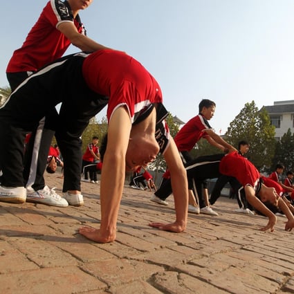 Students work out at Tagou Wushu Academy in Zhengzhou. Photo: ImagineChina