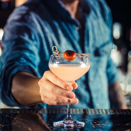 A bartender serves a classic Hemingway Daiquiri at Macau's new Heart Bar.