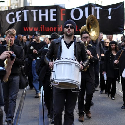 Unidentified Protesters march against the use of fluoride in drinking water in San Francisco. The Marchers believe that fluoride causes health problems.