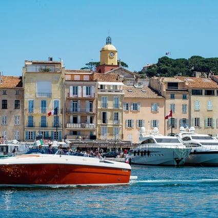 Luxury yachts in the marina of Saint Tropez, French Riviera Launch and building facades in the Old Town of Saint Tropez. Photo: Andia/UIG via Getty Images