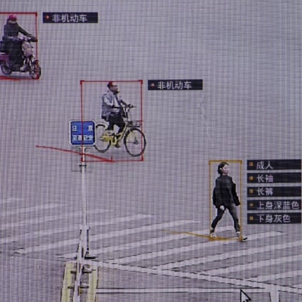 SenseTime surveillance software identifying details about people and vehicles during a demonstration at the company's office in Beijing, China. The descriptions next to the woman reads: Adult, long sleeves, long pants, navy blue top, grey bottom. (Picture: Reuters)