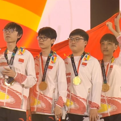 Uzi (third from left) is the captain of the team, and plays alongside two of his teammates from RNG. (Picture: Asian Games 2018)