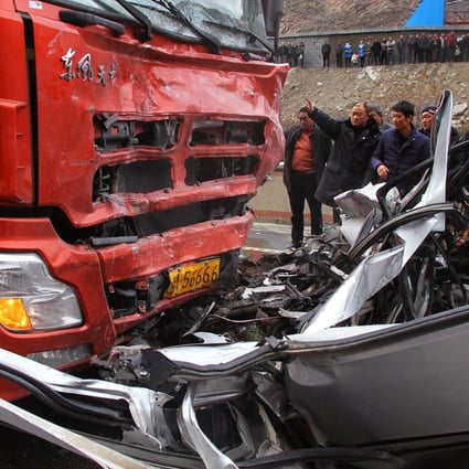 Rescuers work at the site of a road accident on State Highway. Photo: Xinhua