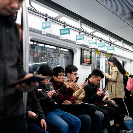 Commuters on a subway in Beijing on April 8, 2019. (Picture: Wang Zhao / AFP)