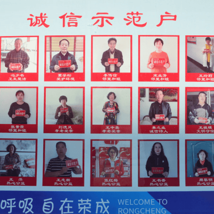 A city notice board in Rongcheng displaying model citizens with high social credit scores. (Picture: Nectar Gan/South China Morning Post)