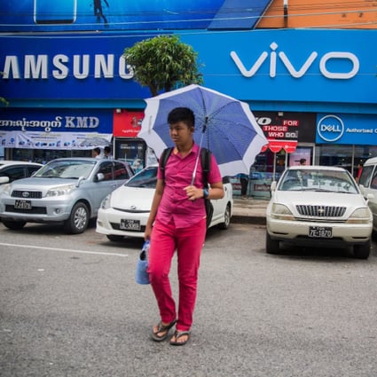 Oppo and Vivo are relying on high visibility to compete with the likes of Samsung, as seen here in Myanmar in 2017. (Picture: Taylor Weidman/Bloomberg)