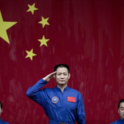 Chinese astronauts Wang Yaping, Nie Haisheng and Zhang Xiaoguang (left to right) before boarding the Shenzhou 10 spaceflight in June 2013. (Picture: AP)