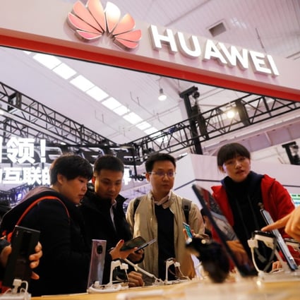 Visitors trying out Huawei’s 5G phones during the World 5G Convention in Beijing on November 21, 2019. (Picture: Wu Hong/EPA-EFE)