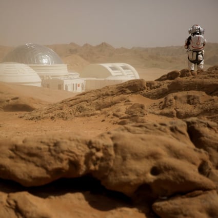 At the C-Space Project Mars simulation base in China’s Gobi Desert, a staff member poses in a mock space suit in April 2019. (Picture: Reuters)