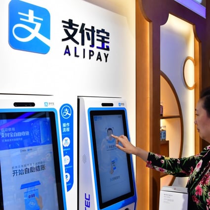 A woman completes payment through Alipay’s face-scanning service at a drug store in Zhengzhou, China on May 24, 2018. (Picture: Feng Dapeng/Xinhua)
