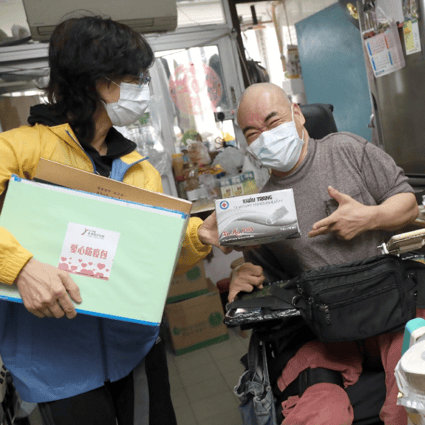 A homebound disabled person receives a care pack funded by The Hong Kong Jockey Club through SAHK, a rehabilitation service organisation.