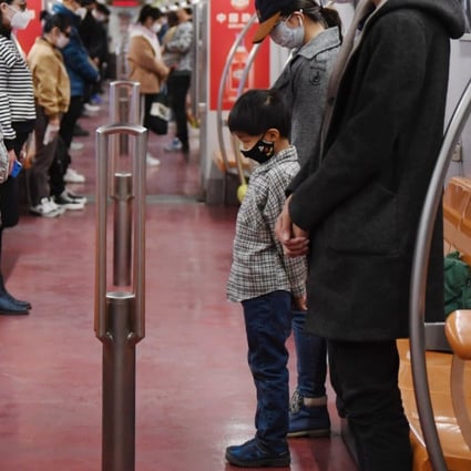 Subway passengers in Beijing pay a silent tribute to Covid-19 victims on April 4. (Picture: Xinhua)