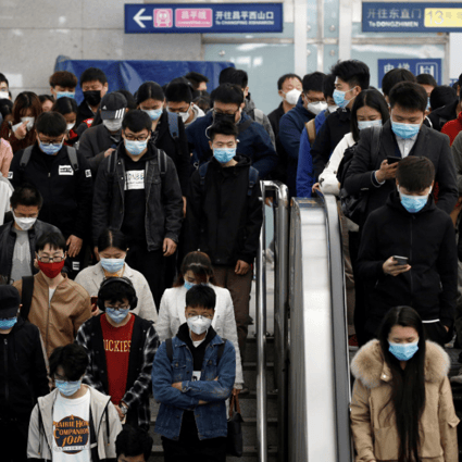 Passengers inside a subway station during morning rush hour in Beijing on April 7. Apple Pay has been available on public transport in the capital and Shanghai since 2018. (Picture: Tingshu Wang/Reuters)