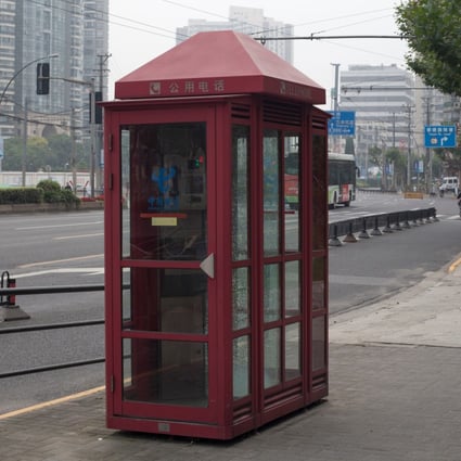 An old telephone booth in a street in Shanghai on July 5, 2019. (Picture: Fernando Garcia Esteban/Shutterstock)