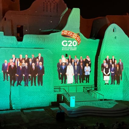 Projection of a "Family Photo" for the annual G20 leaders' summit onto Salwa Palace in At-Turaif, one of Saudi Arabia's UNESCO World Heritage sites, in Diriyah, Saudi Arabia. Photo: Reuters