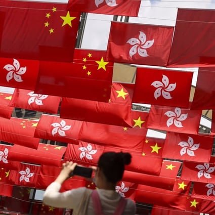National and Hong Kong flags on display to celebrate the 24th anniversary of the handover in 2021. Photo: May Tse