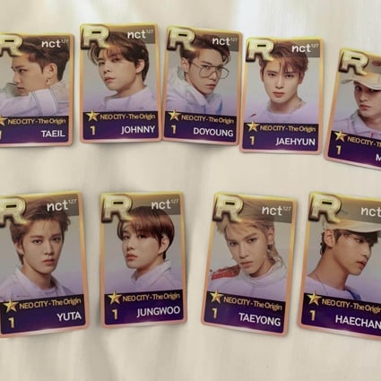 Photocards featuring NCT 127. K-pop fans are keeping the spirit of buying, selling and trading cards alive with pint-sized photos of K-pop stars they can put in their wallets.