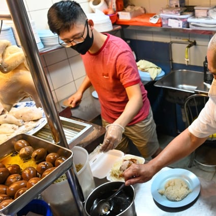 Lim Wei Keat is an apprentice at Neo’s chicken rice stall in Singapore. Photo: Roslan Rahman/AFP