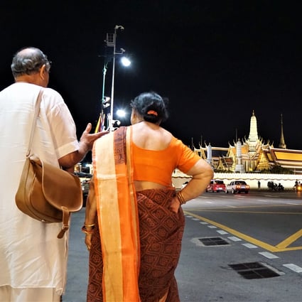 Indian tourists outside the Grand Palace in Bangkok, Thailand, in June 2019.